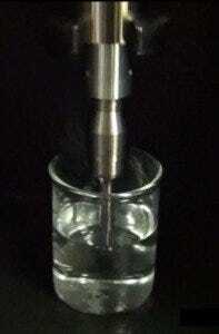 Probe in sample, delivering ultrasonic vibration (Q700 from QSonica)