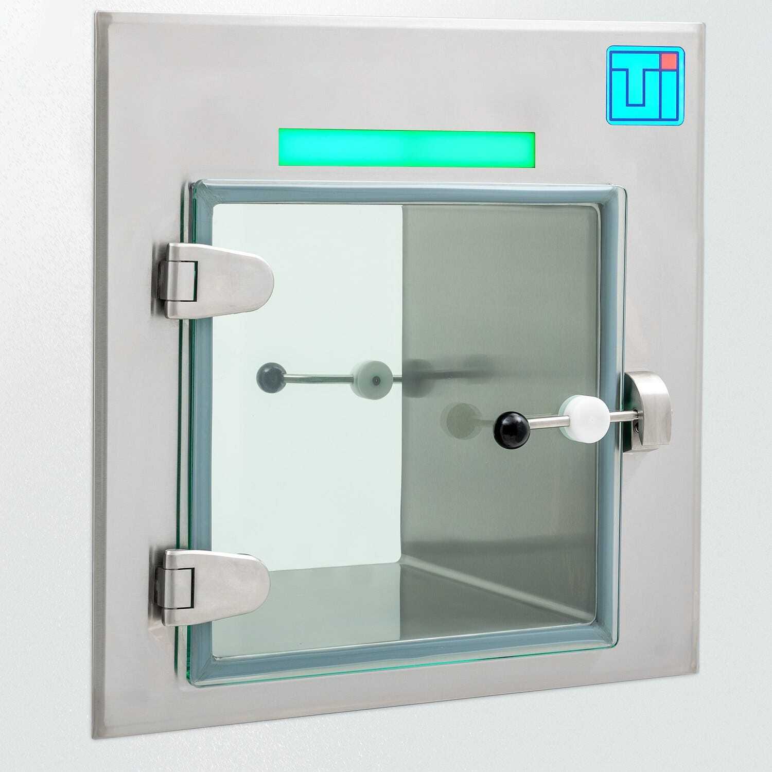 Photo of a smart stainless steel pass-through with a frameless glass door